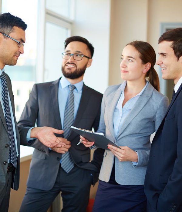 Confident businesspeople listening to their partner explaining his idea