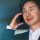 Confident asian businessman talking on mobile phone on blurred background.